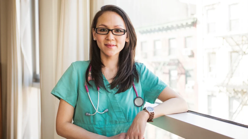 Home health nurse smiling while providing compassionate in-home care support