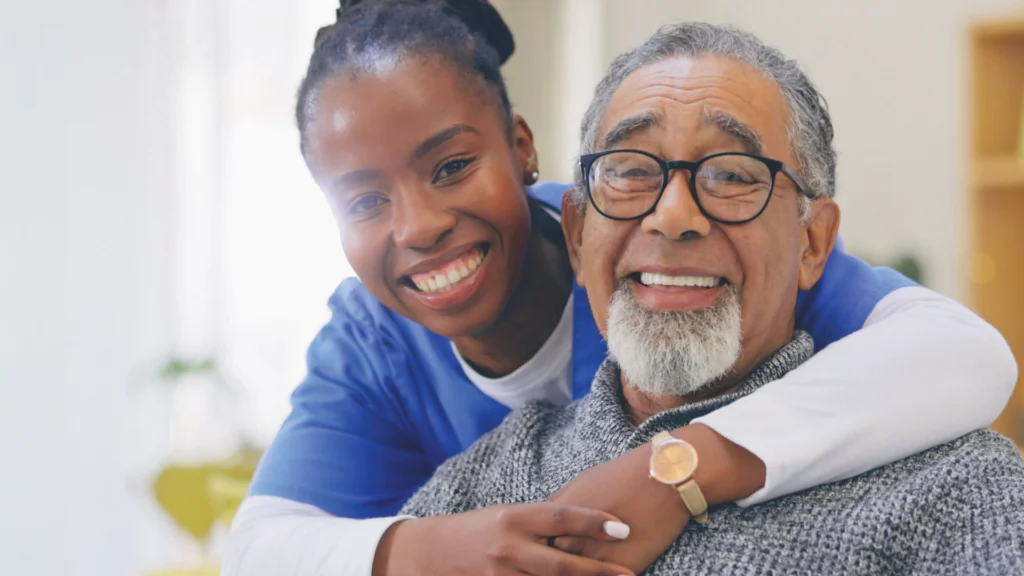 Home health aide providing compassionate in-home care support to a senior