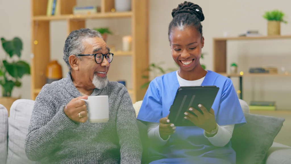 Caregiver reviewing care information with a senior while providing supportive in-home senior care in Tampa, FL