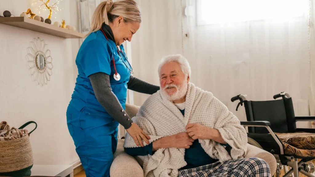 Healthcare worker assisting an adult post-hospital transition in Central & Southern Florida