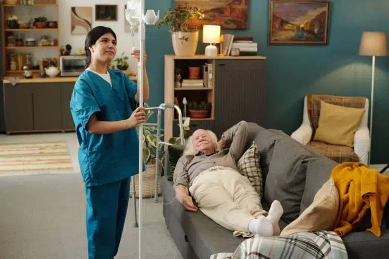 Adjusting an IV drip for a home infusion patient in Central & Southern Florida