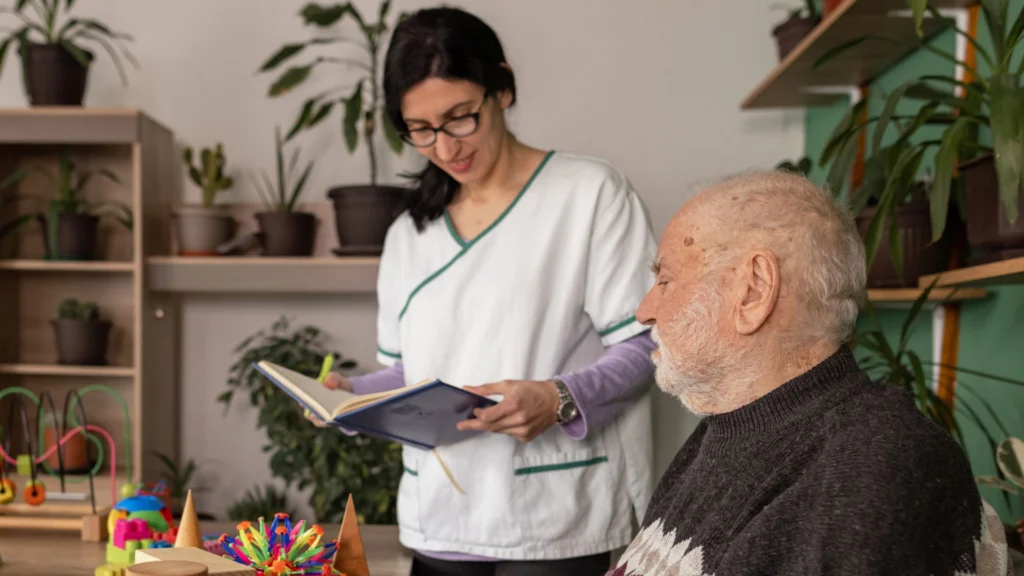Caregiver holding a notebook while assisting an elderly person in Central & Southern Florida