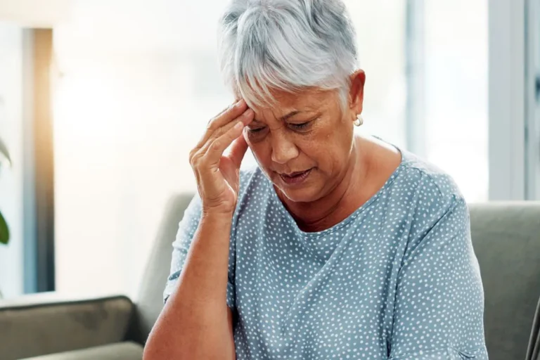A person sitting on a couch, showing early signs of dementia in Central and Southern Florida